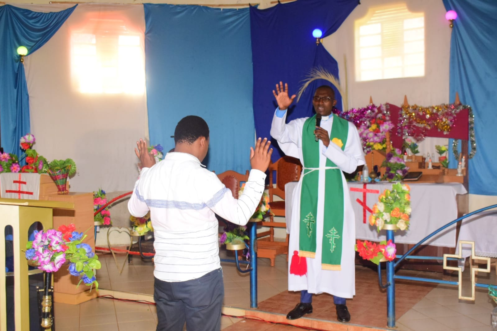 Charles Justus receiving prayers — values, humility, leadership